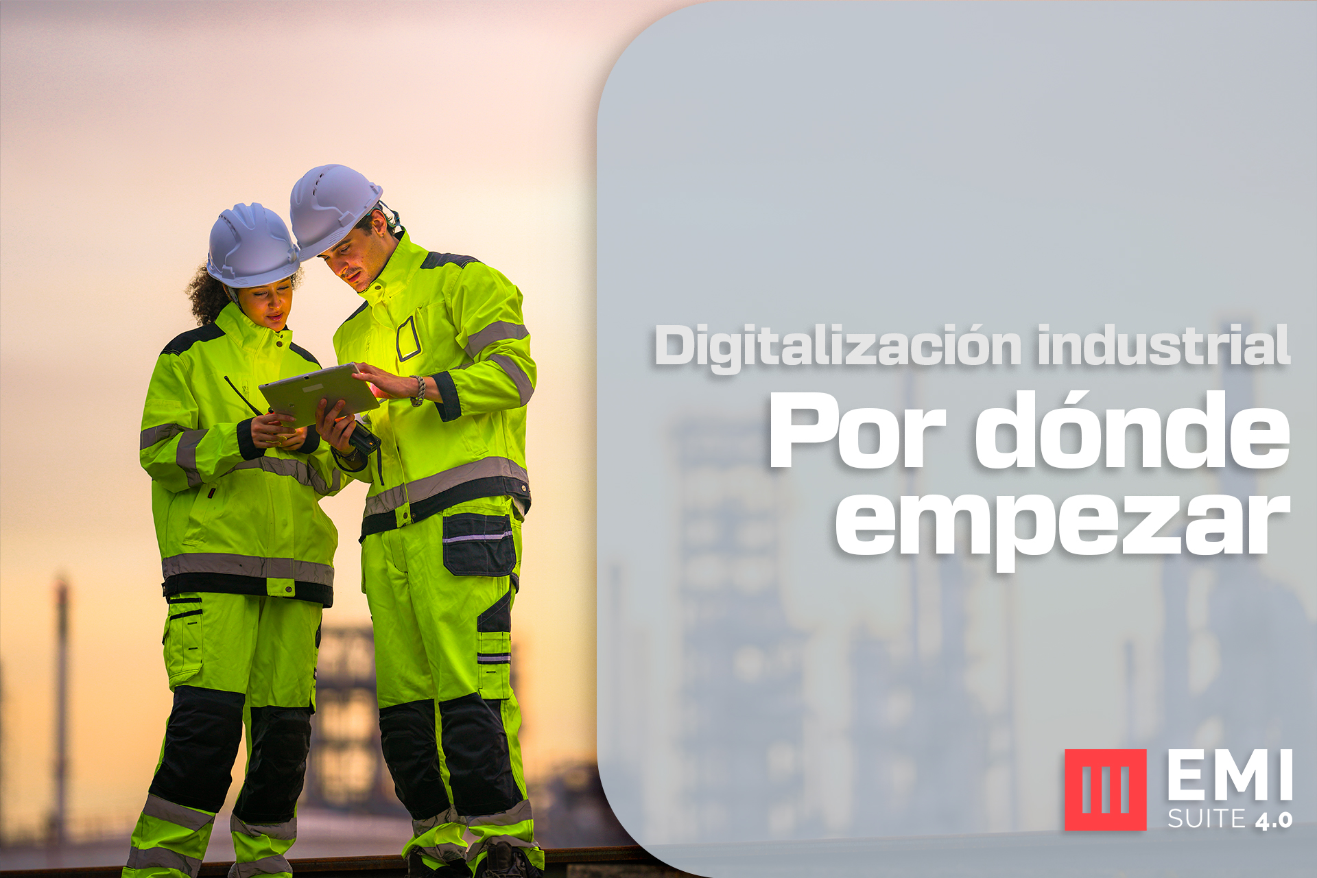Dos ingenieros consultando tablet en planta industrial representando la digitalización industrial con EMI Suite 4.0